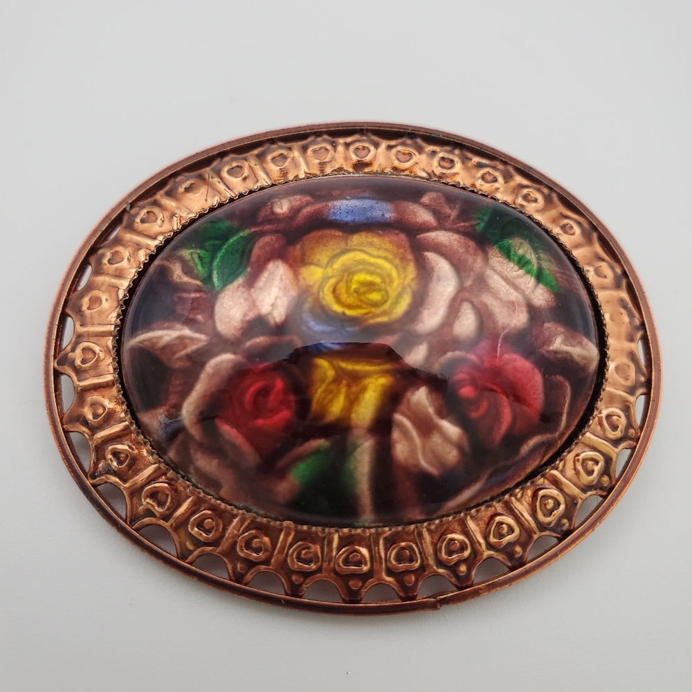 Vintage Oval Domed Infused Floral Brooch Set In An Ornate Copper Bezel